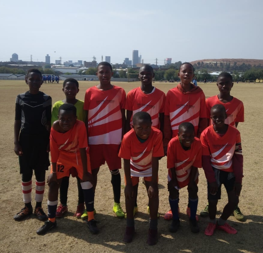 Wembley FC players in red kit